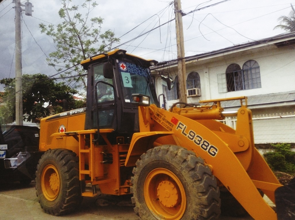 bulldozer trucks in tacloban city after typhoon yolanda